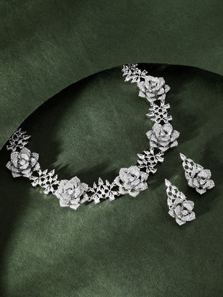 Women Rhodium-Plated AD-Studded Floral Motifs Detail Necklace & Earrings VitansEthnics