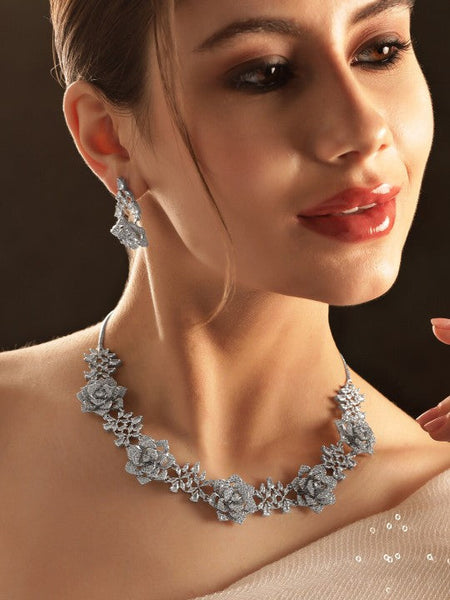 Women Rhodium-Plated AD-Studded Floral Motifs Detail Necklace & Earrings VitansEthnics